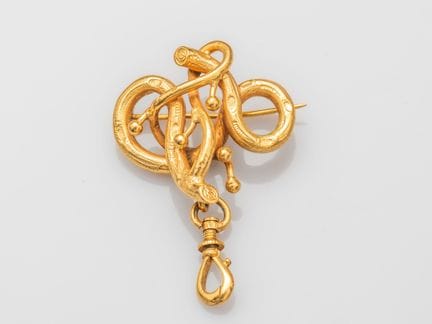 Broche en or jaune 750°/°° (18K), stylisant une br