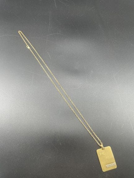 Ciondolo in oro giallo 18 carati 750°/°°, con marc