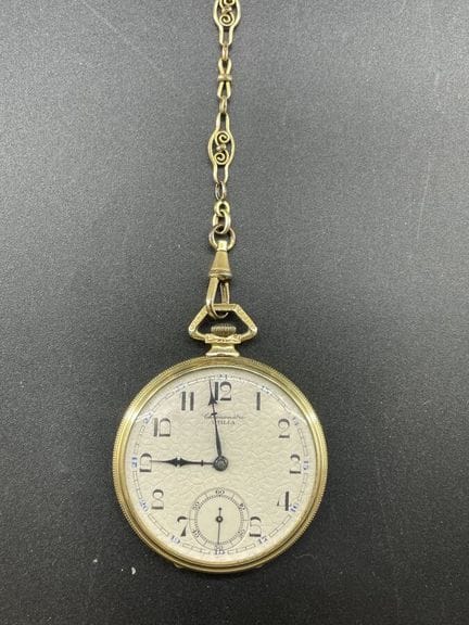 Orologio da tasca in metallo dorato con catena in 
