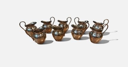 9 piccole brocche per il latte in argento 900/°° (