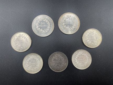 2 monete da 50 franchi in argento e 5 monete da 10