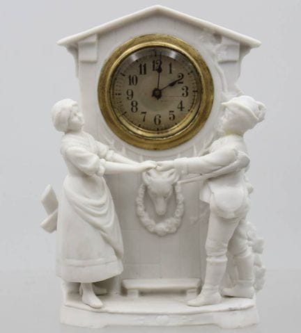 Orologio da tavolo in porcellana biscuit, meccanis