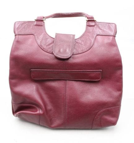Borsa vintage in pelle rossa, segni di usura, circ