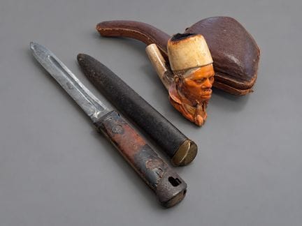 Pipe en écume de mer à une tête d'homme portant la