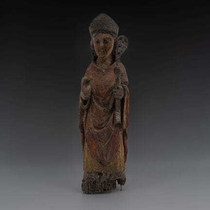 一件古色古香的多色彩绘木雕，描绘了一位主教圣人。
 
 约16世纪作品。
 
 状况：多色彩绘部分因