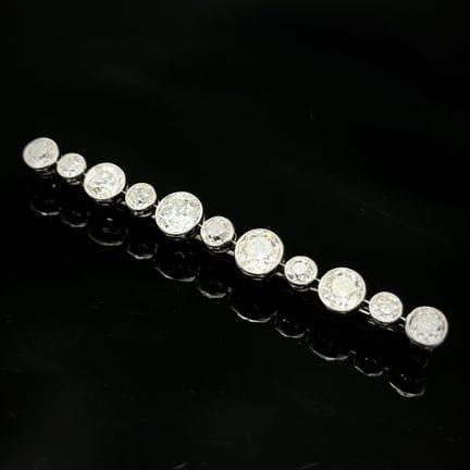 Broche barrette en or gris 750 et platine 850 mill