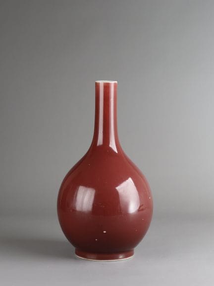 A Copper-red Bottle Vase, 19th century, Of elegant