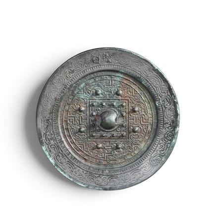 Miroir en bronze gravé de motifs TLV, de la dynast