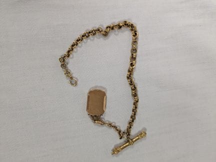 Chaîne de montre en or jaune 18K, avec sa clef (mé
