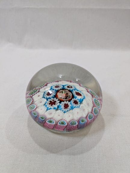 Sulfur-colored paperweight with a millefiori desig