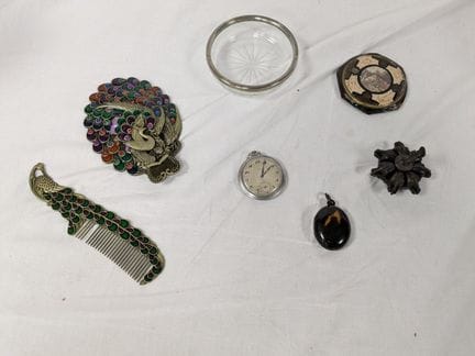 Set made of metal, glass, and resin, including a m
