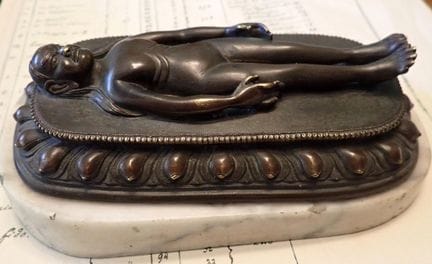 Nepal or India: reclining deity, patinated bronze 