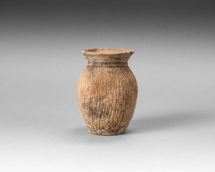 Small terracotta jar with an ovoid body and a flar
