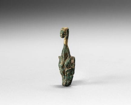 Gilded bronze fibula; the hook ends in a dragon’s 