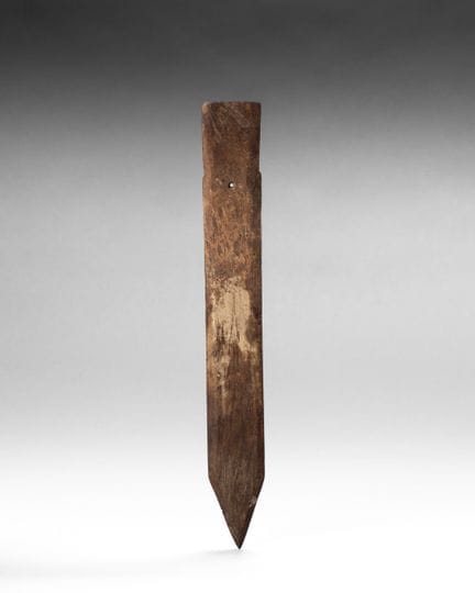 Ceremonial blade made of beige and ochre calcified