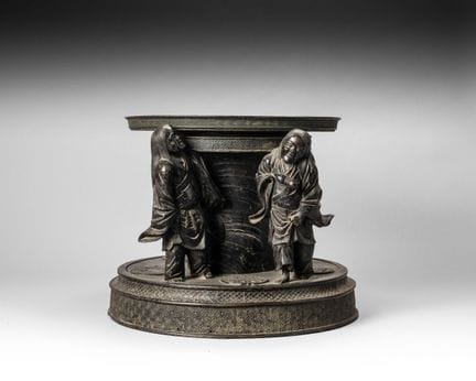 Bronze incense burner stand with a brown patina; t