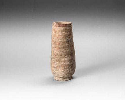 Terracotta vase resting on a small foot, tubular i