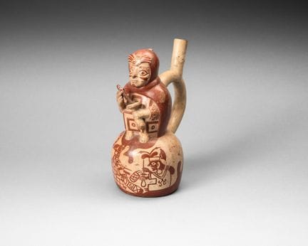 Vase boule surmonté d’un prêtre préparant une poti