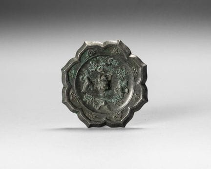 A silver-plated bronze mirror in the Linghua style