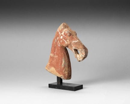 Terracotta head of a neighing horse with traces of