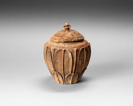 Covered terracotta funerary jar; the body is decor