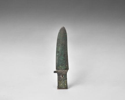 Bronze halberd blade with a dark green patina; the