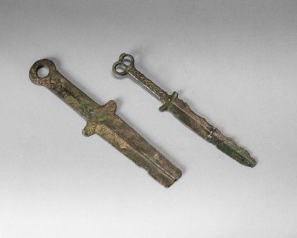 Three swords:
- one made of bronze, with a hilt en