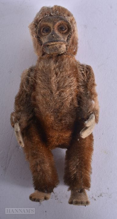 A VINTAGE MONKEY possibly Schuco. 12 cm high.