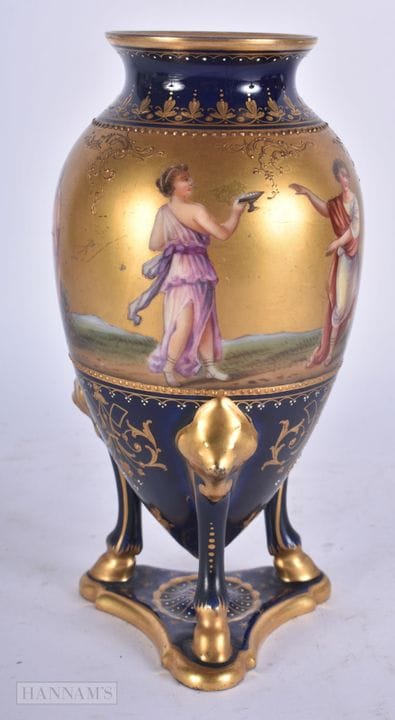 AN ANTIQUE VIENNA PORCELAIN AMPHORA FORM VASE. 18.