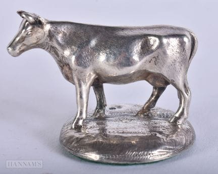 A VICTORIAN SILVER FIGURE OF A COW. 50 grams. 4 cm