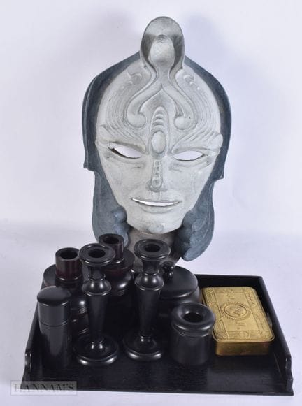 A LARGE THEATRICAL MASK together with an ebony dre