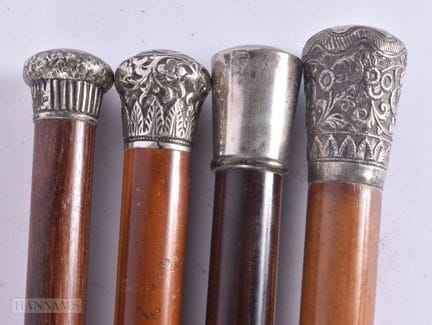 CUATRO BASTONES ANTIGUOS CON MONTURA DE PLATA. 95 