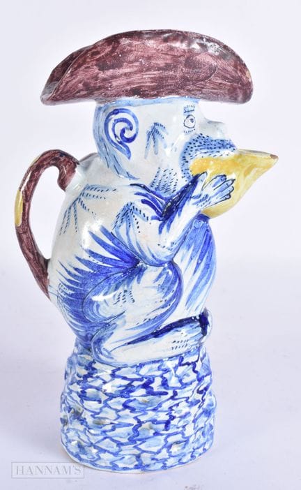 A 19TH CENTURY DELFT FAIENCE TIN GLAZED JUG AND CO