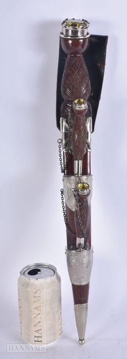 A LARGE SCOTTISH WHITE METAL MOUNTED DIRK DAGGER. 