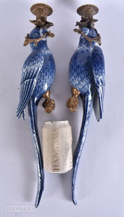 A PAIR OF CONTINENTAL CERAMIC PARROT BRONZE CANDLE