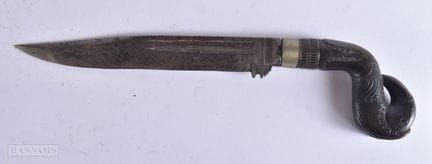 A 19TH CENTURY MIDDLE EASTERN CARVED HORN HANDLED 