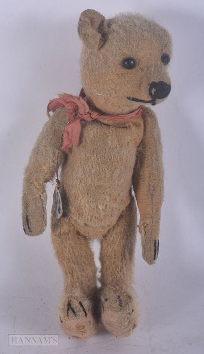 UN OURS EN PELUCHE VINTAGE. 25 cm de haut.