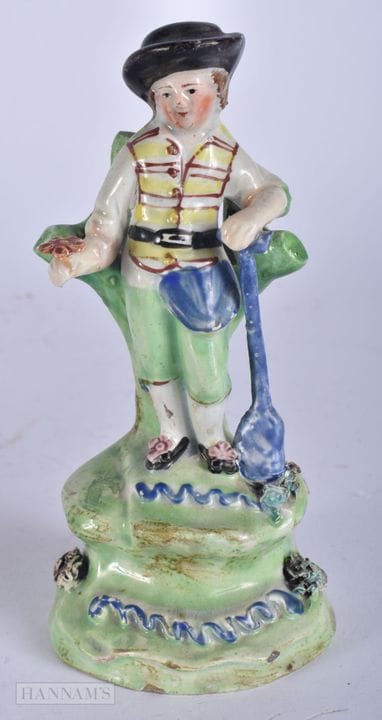 AN EARLY 19TH CENTURY STAFFORDSHIRE WALTON FIGURE 