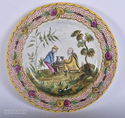 AN ANTIQUE CONTINENTAL POTTERY 'CHINESE TEA CEREMO