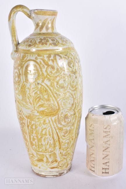 A 19TH CENTURY MIDDLE EASTERN ISLAMIC POTTERY EWER