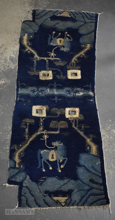 A LATE 19TH CENTURY CHINESE BLUE EMBROIDERED EQUES