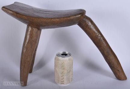 AN ANTIQUE AFRICAN TRIBAL STOOL. 33 cm x 40 cm.