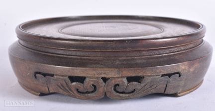 A CHINESE CARVED HARDWOOD DISPLAY STAND. 16.5 cm w