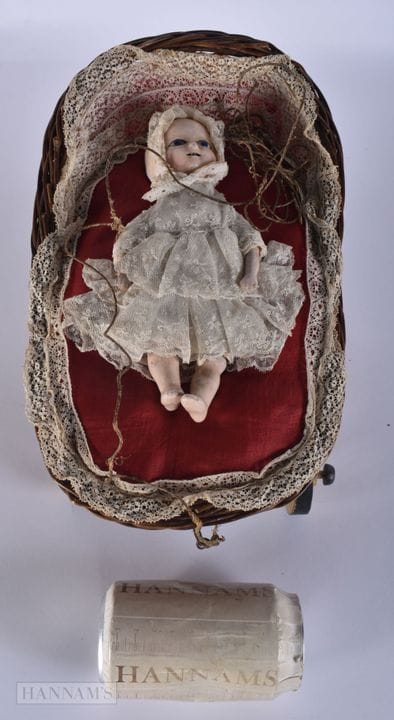 A RARE EARLY 19TH CENTURY AUTOMATON DOLL IN PRAM. 