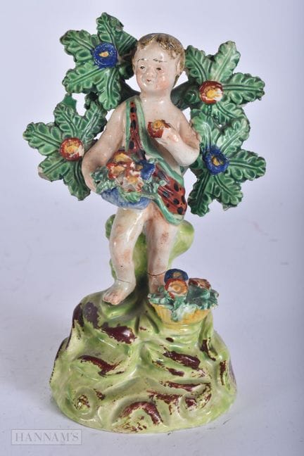 AN EARLY 19TH CENTURY STAFFORDSHIRE WALTON FIGURE 
