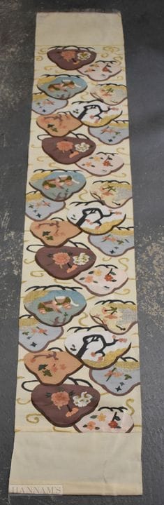 A JAPANESE SILK EMBROIDERED PANEL. 170 cm x 35 cm.