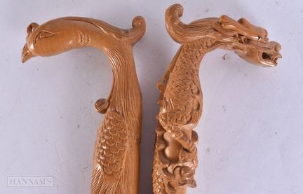 TWO CHINESE CARVED WOOD WALKING CANES. 90 cm long.
