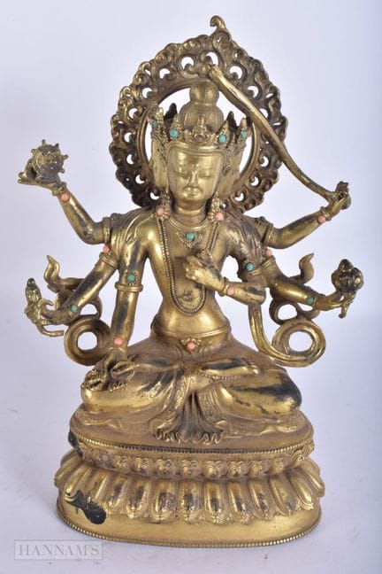 EINE CHINESISCH-TIBETISCHE BUDDHA-FIGUR AUS VERGOL