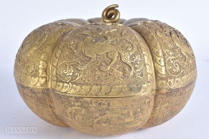 AN EARLY 20TH CENTURY CHINESE TIBETAN GILT METAL L