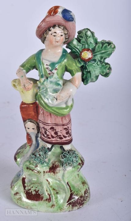 AN EARLY 19TH CENTURY STAFFORDSHIRE WALTON FIGURE 